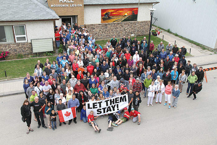 Hundreds of people posed for a photo with the Santos family during a fundraising lunch last week to show their support of the family, who were facing deportation. News came during the lunch that the family would be allowed to stay in Canada.