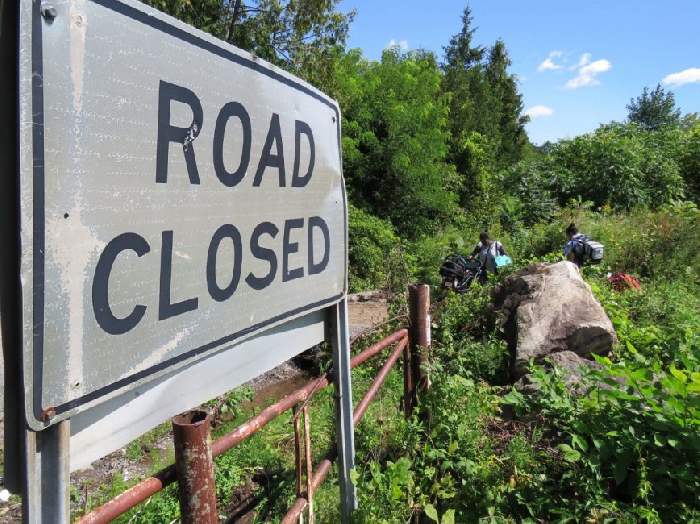 Asylum seekers originally from Haiti cross from the United States into Canada