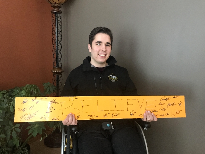 Morgan Gobeil with the “Believe” sign Humboldt Broncos Assistant Coach Chris Beaudry brought to the hospital in Saskatoon just days after the accident. The sign stayed at the hospital until the last boy—Morgan— came home, just as Beaudry intended.