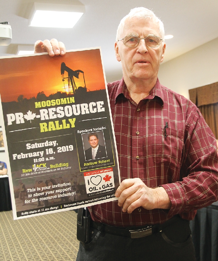 Sinclair Harrison holds up the poster for the planned Moosomin pro-resource rally at the Chamber meeting Wednesday. Harrison and Bill Thorn spoke about the rally being planned for Feb. 16 with Andrew Scheer as guest speaker.