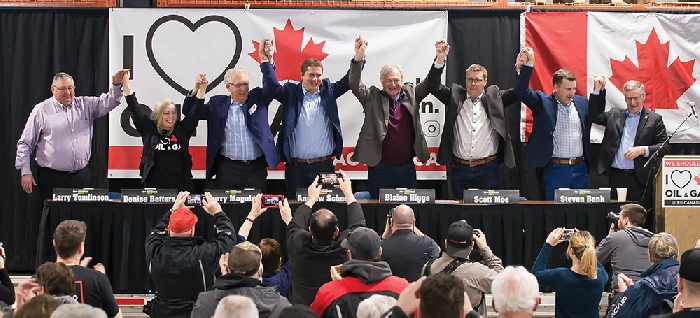 Speakers join hands at the end of the Pro-Resource Rally in Moosomin on Saturday, Feb. 16. From left are Mayor Larry Tomlinson, Senator Denise Batters, Brandon-Souris MP Larry Maguire, Opposition Leader Andrew Scheer, New Brunswick Premier Blaine Higgs, Saskatchewan Premier Scott Moe, and Moosomin MLA Steven Bonk.