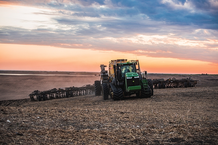 Kristjan Hebert seeding at Hebert Grain Ventures near Fairlight on Thursday. This photo was submitted by Olga McCarthy as part of the World-Spectators spring seeding photo contest.