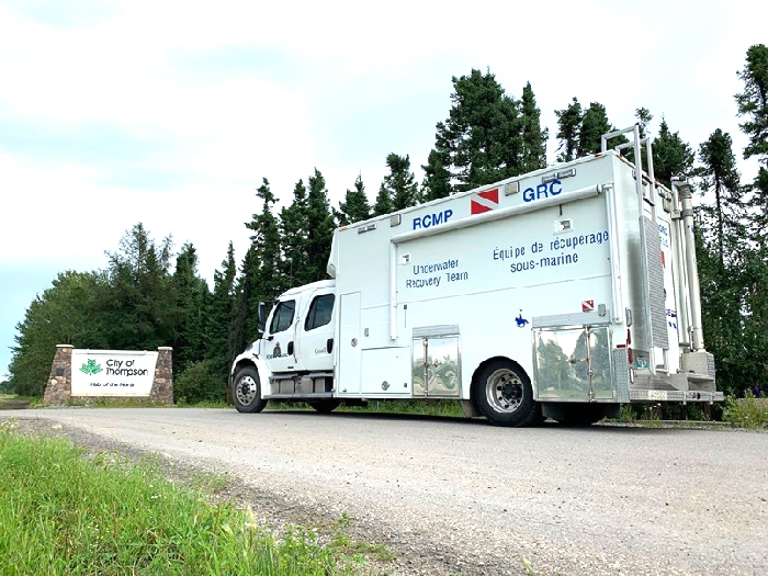 An RCMP underwater recovery team vehicle passes through Thompson, Manitoba on the way to Gillam