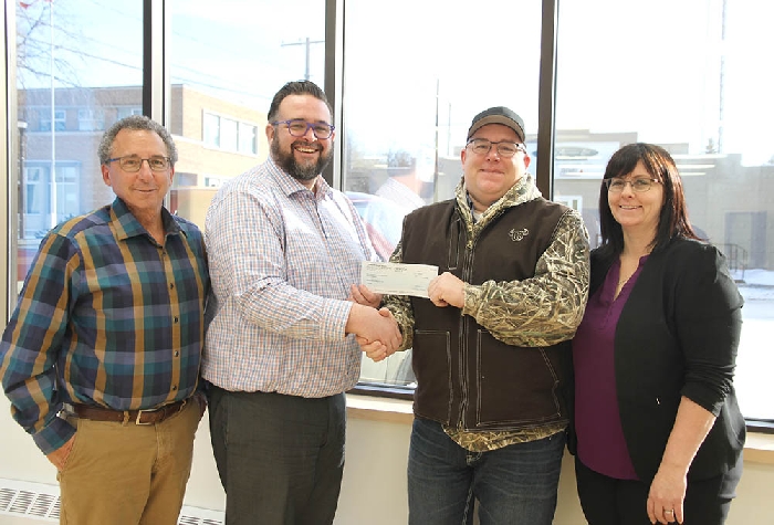 <b>$100,000 from Conexus for airport</b><br> Conexus Credit Union presented a cheque for $100,000 last week for the expansion of Moosomin’s airport to accommodate the Saskatchewan Air Ambulance. From left are Jeff St. Onge of the airport planning committee, Conexus Moosomin Branch Manager Brandon Carter, RM of Moosomin Reeve David Moffatt and RM of Moosomin administrator Kendra Lawrence.