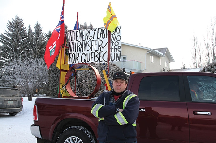 Western Canada has erupted in protest over denial of pipeline projects. Last week there was a truck rally from Virden to Brandon and a rally for resources in Regina that included some local residents. Cory Garvey made this sign for the Virden truck convoy, including a section of pipe. See inside for more photos from both events.