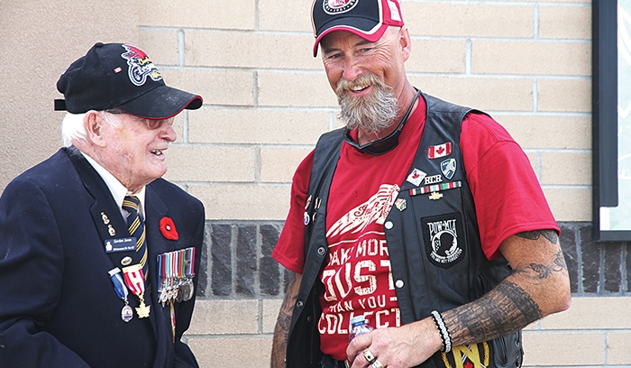 Rolling Barrage organizer Scott Casey speaks with Moosomin veteran Gordon Jones at last year’s fundraiser in Moosomin.