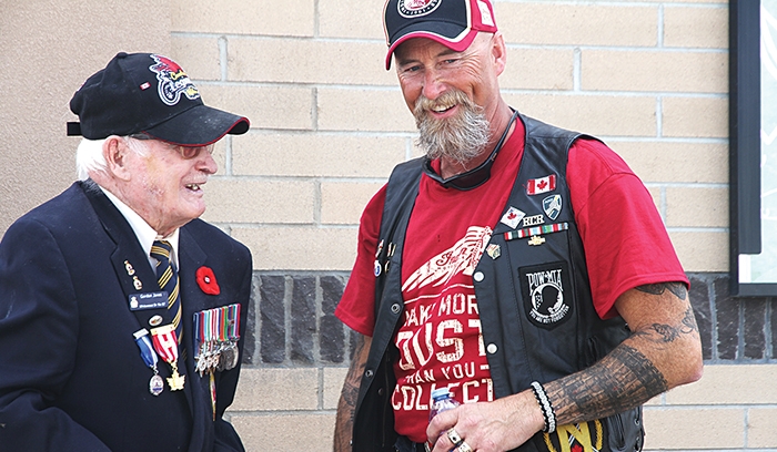 Rolling Barrage organizer Scott Casey speaks with Moosomin veteran Gordon Jones at last years fundraiser in Moosomin.