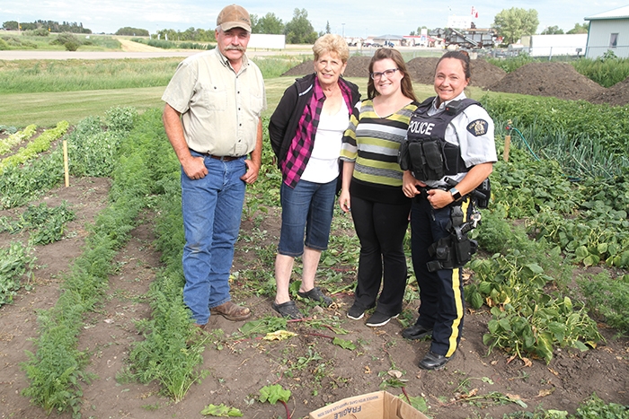 Tim Hovdestad, Marilyn Klinger, Samantha Campbell and Trina Brace at the community garden.