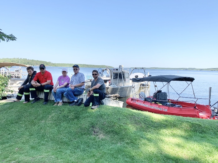 The Hutterian Emergency Aquatic Response Team out of Oak Bluff, Man., were recently at Makwa Lake near the Makwa Sahgaiehcan First Nation in Saskatchewan to recover the body of a missing six-year-old boy. They were joined by Sandy and Gene Ralston from Boise, Idaho, who also joined in the search. Left to right are Tyler Maendel, Paul Maendel, Sandy and Gene Ralston and Manuel Maendel. Photo courtesy of Manuel Maendel Becky Zimmer, Local Journalism Initiative Reporter