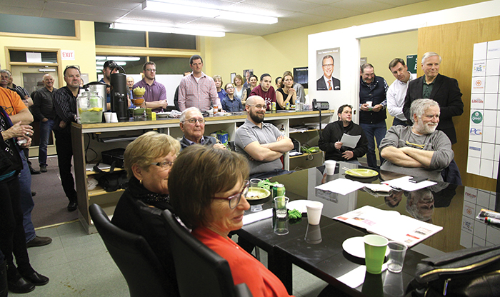 The crowd at Steven Bonks campaign offices watch as Premier Brad Wall makes his victory speech on election night. Former Moosomin MLA Don Toth and newly elected MLA Steven Bonk are standing at right.