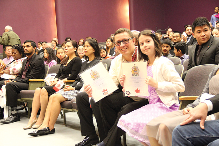 Roman Chernykh and his daughter Anna at the Canadian citizenship ceremony in Regina.