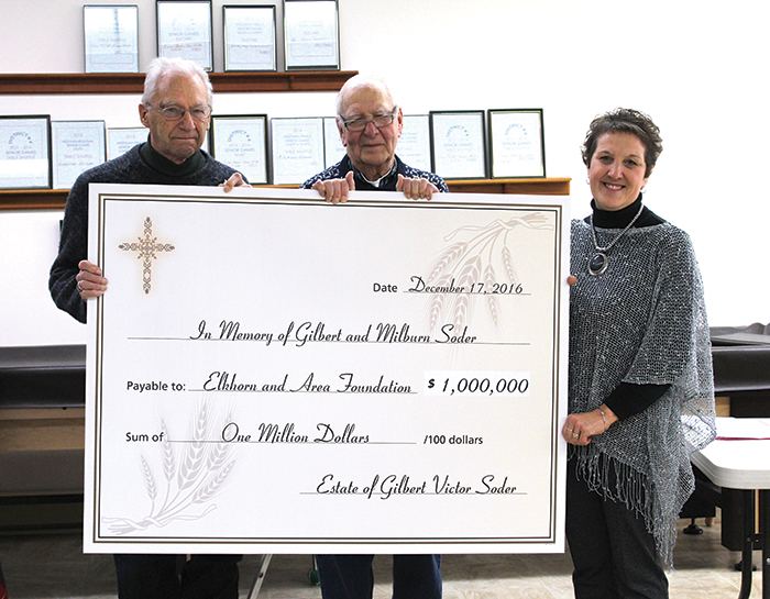 Murray Soder, left, presents a cheque for $1 million to Bob Nesbitt, centre, the first chair of the Elkhorn and Area Foundation, and to Brenda Orr, the current chair of the foundation. The donation is in memory of  Milburn and Gilbert Soder, two Elkhorn farmers who, through hard work and despite many hardships, created a successful farming operation.