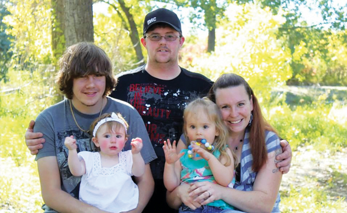 Dad David in back, big brother Jason holding little sister Autumn, Rayne and mom Tina.