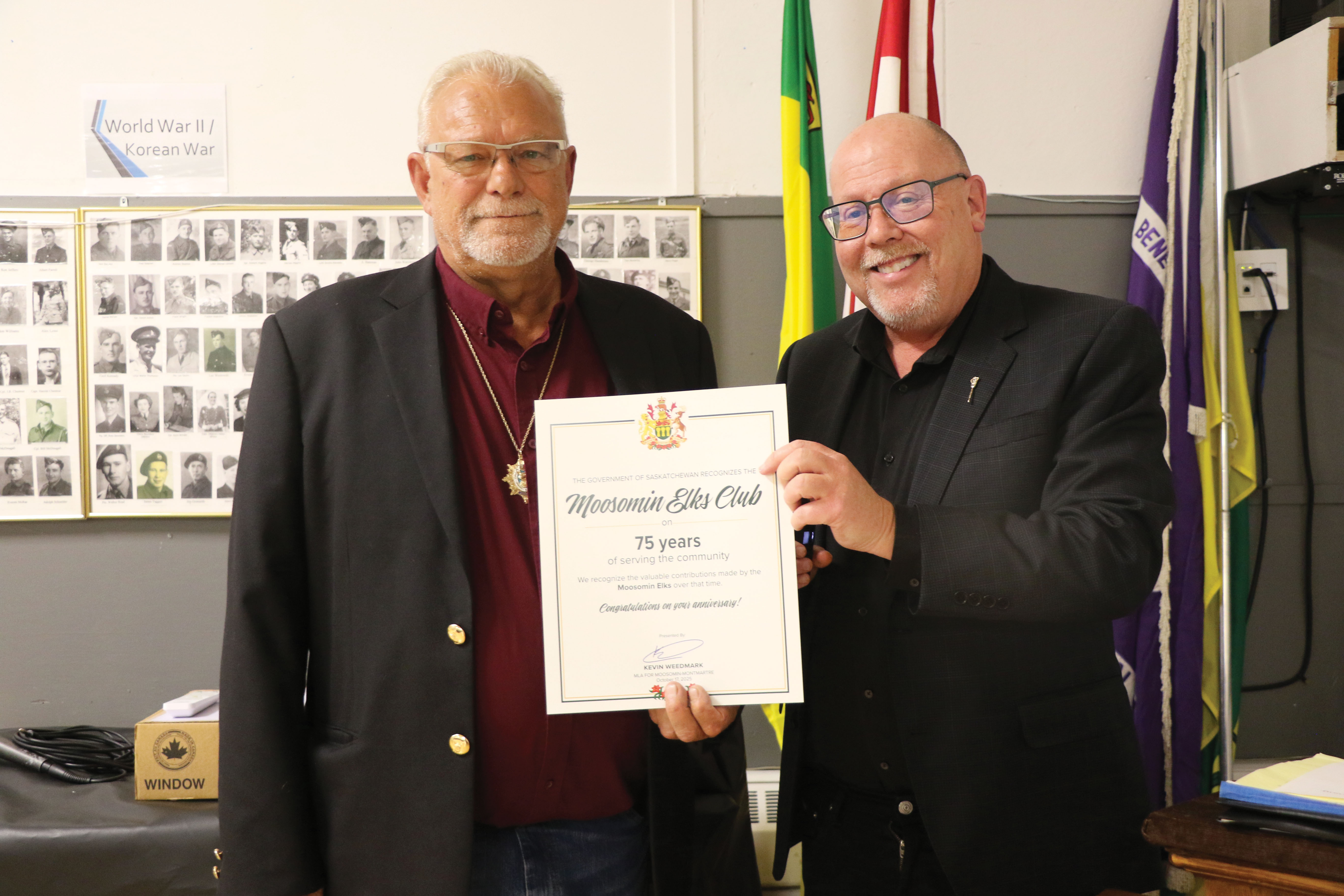 Moosomin-Montmartre MLA Kevin Weedmark congratulating Moosomin Elks President Ron Potter on the Moosomin Elks’ 75th anniversary.