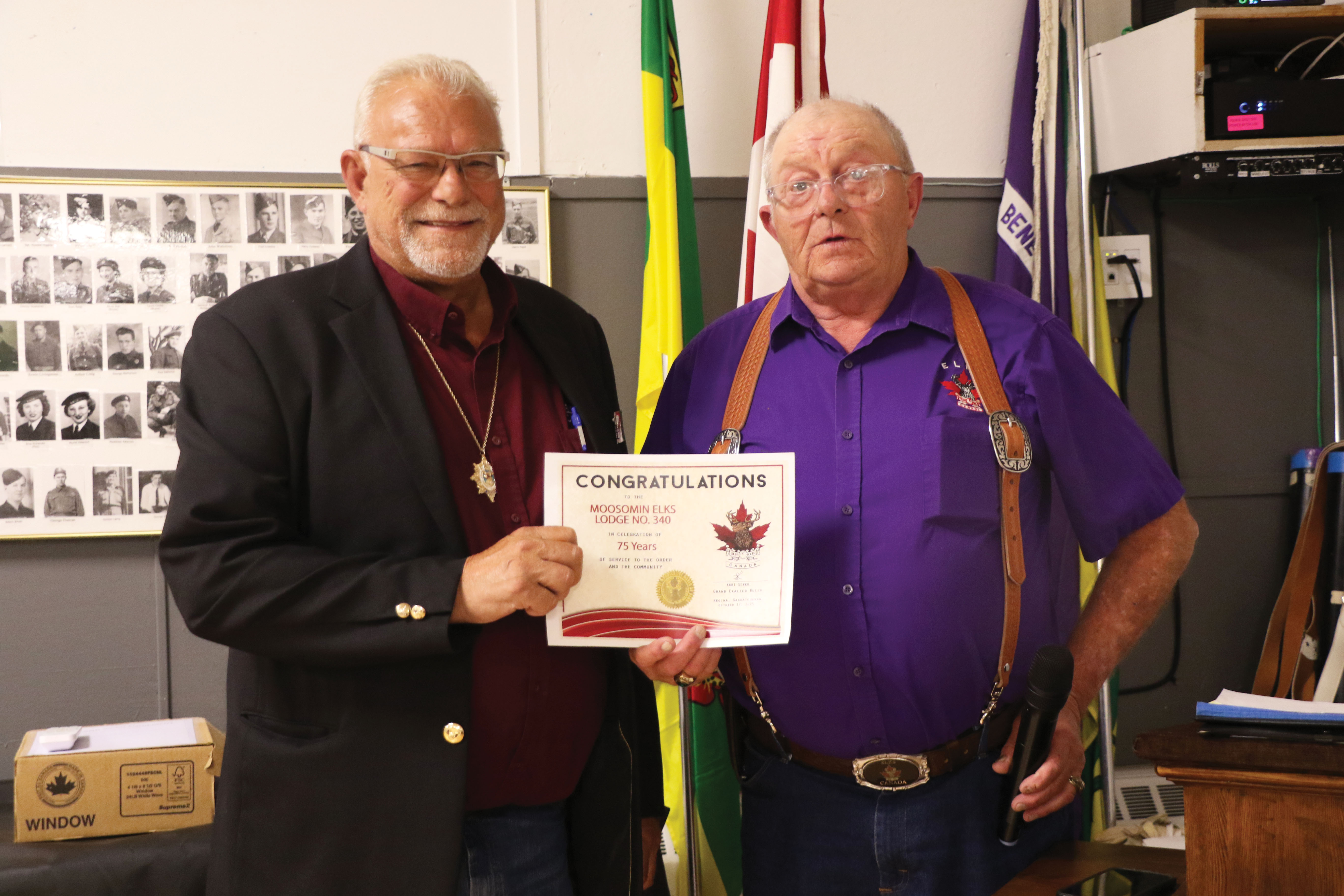 Grand Lodge representative Eugene Hartter from Wilkie congratulating Moosomin Elks President Ron Potter on the Moosomin Elks’ 75th anniversary.