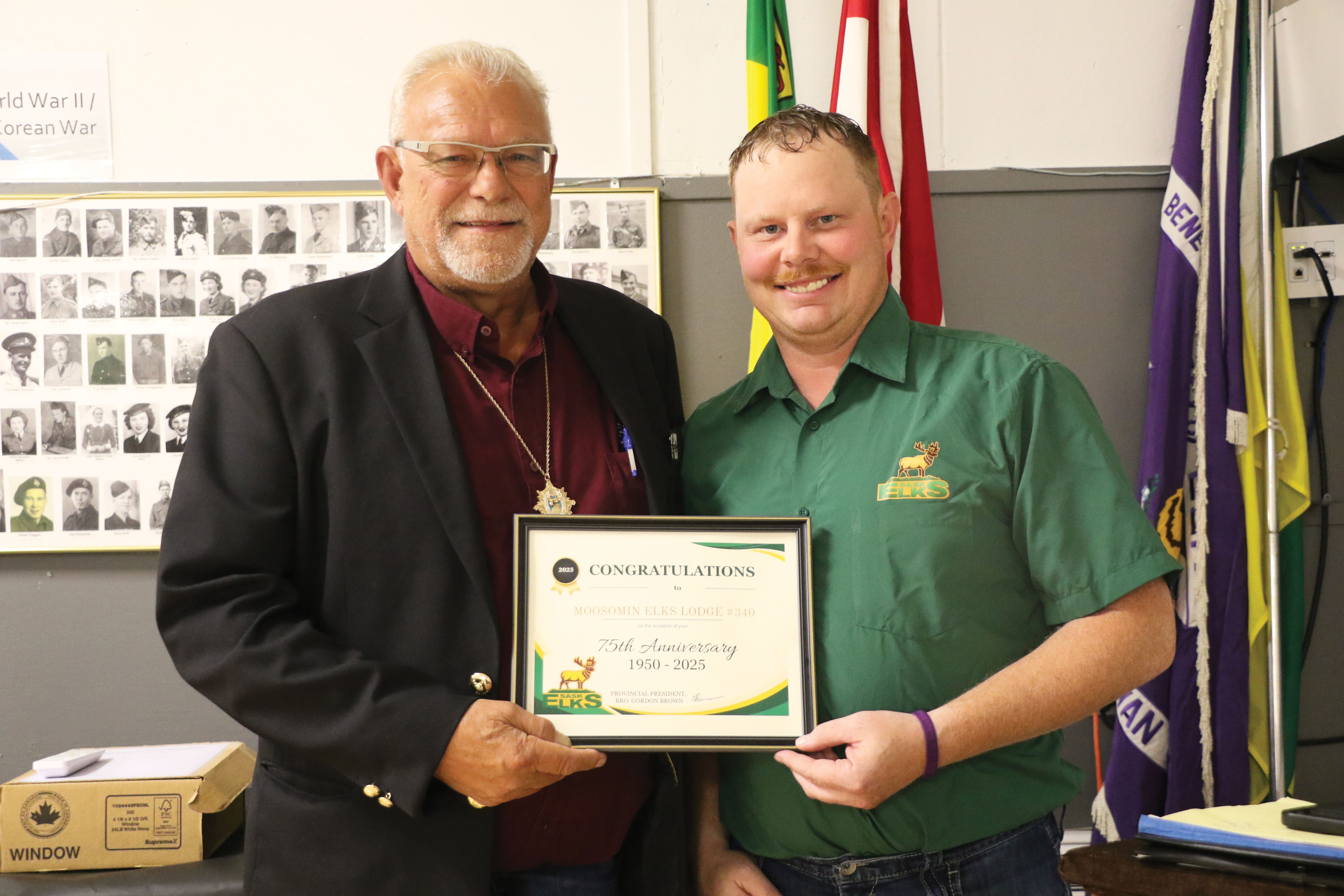 Saskatchewan Elks President Gordon Brown from Shaunavon congratulating Moosomin Elks President Ron Potter on the Moosomin Elks’ 75th anniversary.