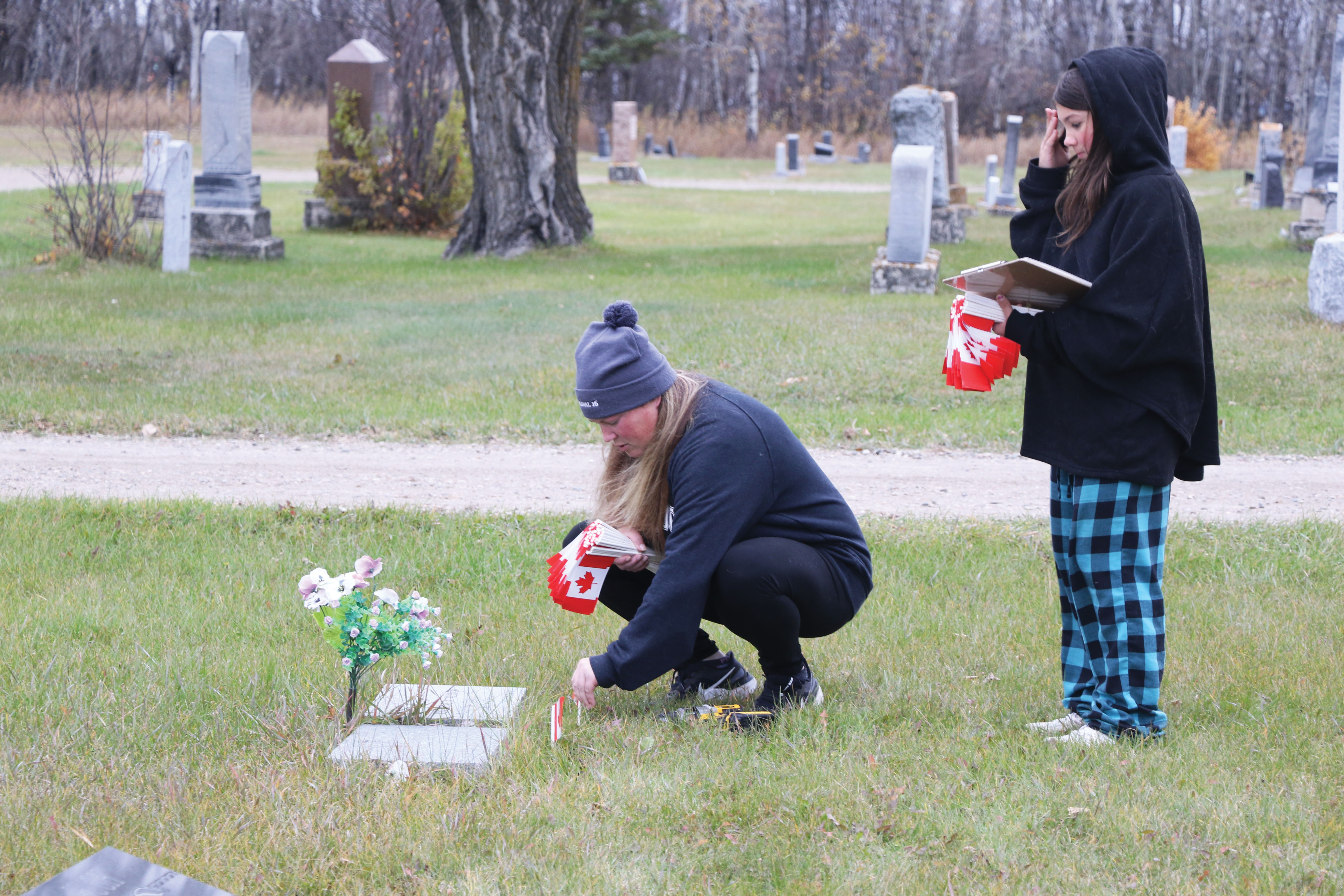 Shannon Beckett and Clara Dodsworth placing flags
