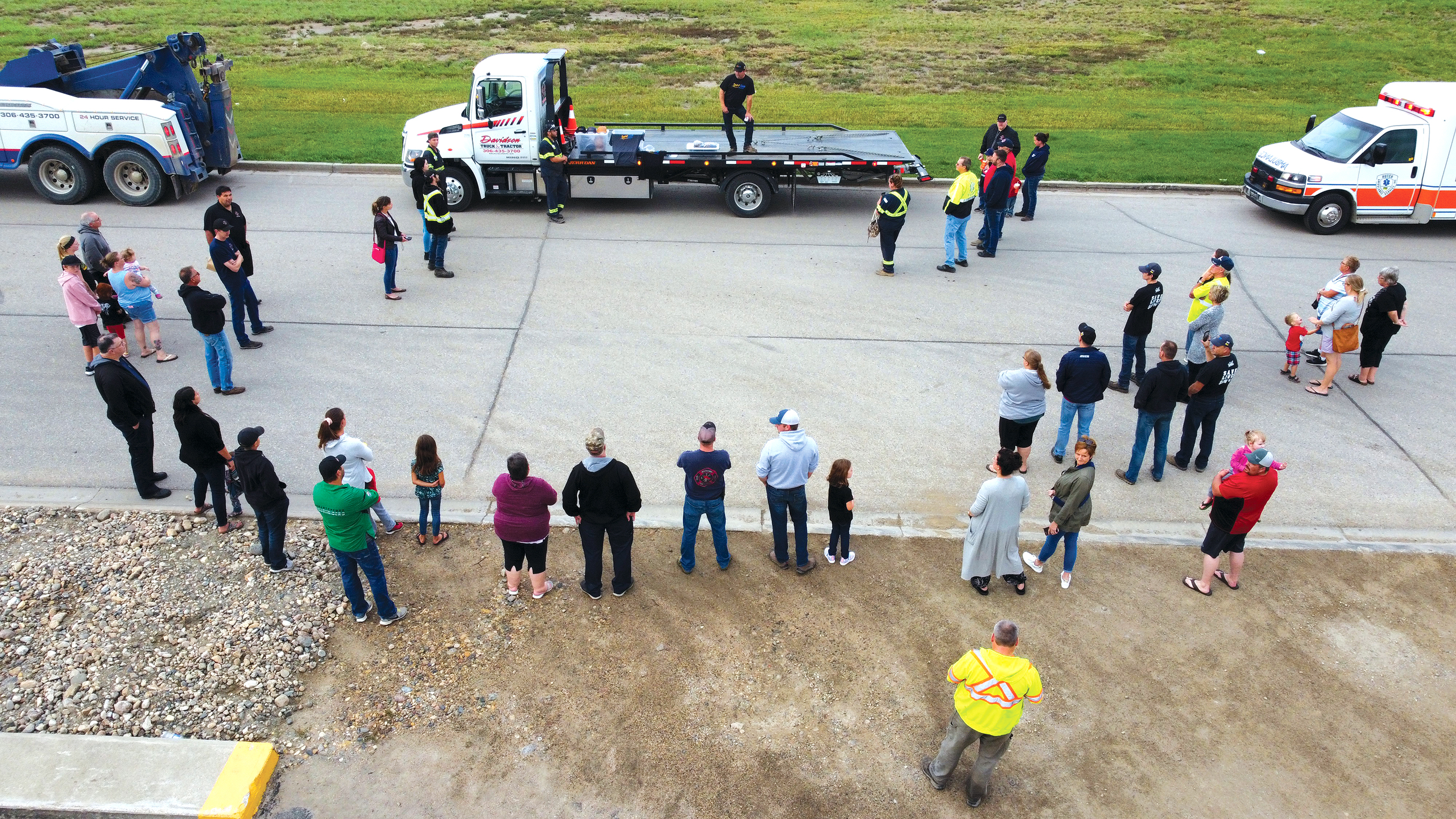 Todd Davidson giving a speech at the event while people gather to listen.