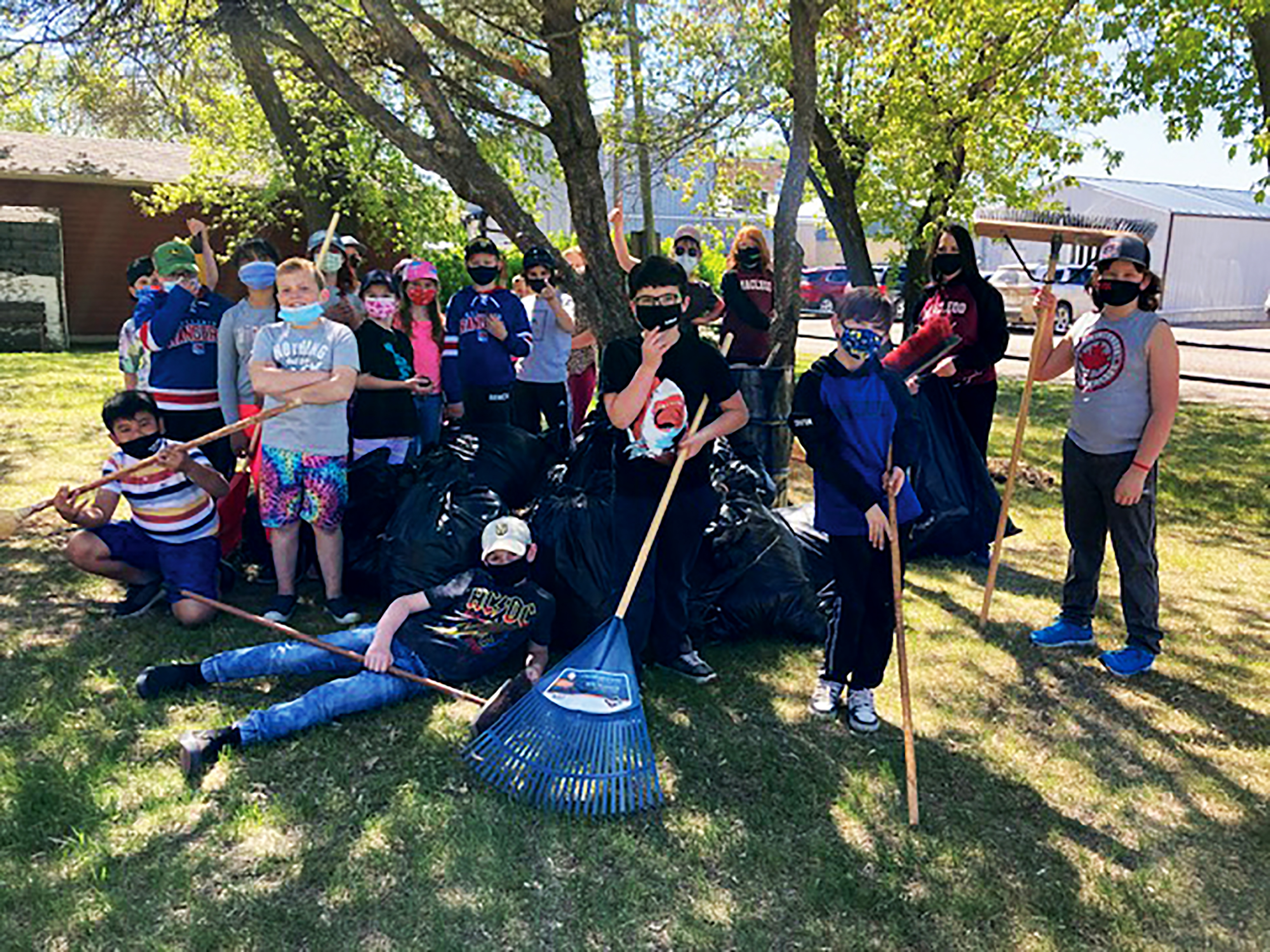 A job well done. After a busy afternoon the Grade 4 students pose in front of their hard work.