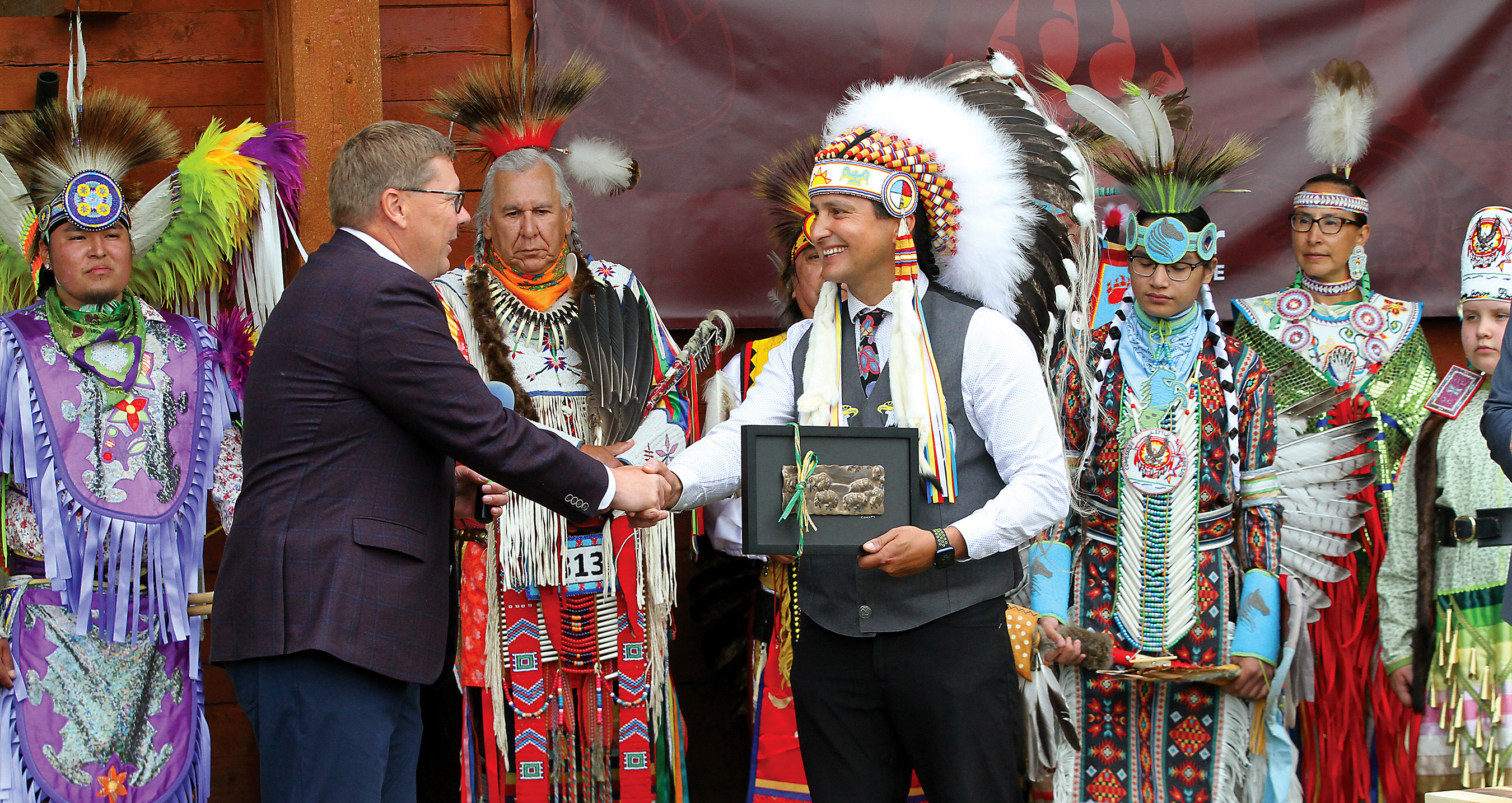 Saskatchewan Premier Scott Moe exchanges gifts with Chief Cadmus Delorme during last Tuesday’s ceremony.