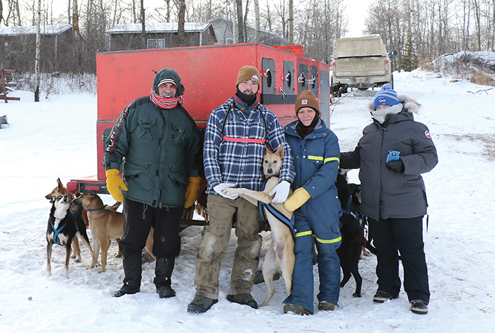 Eagle Ridge Dog Sled Tours, owner Garrick Schmidt, has about 24 dogs who have been in training since September. Left: Calvin Racette, Garrick Schmidt, Shannon Landrie-Crossland and Heather Witherspoon.<br />