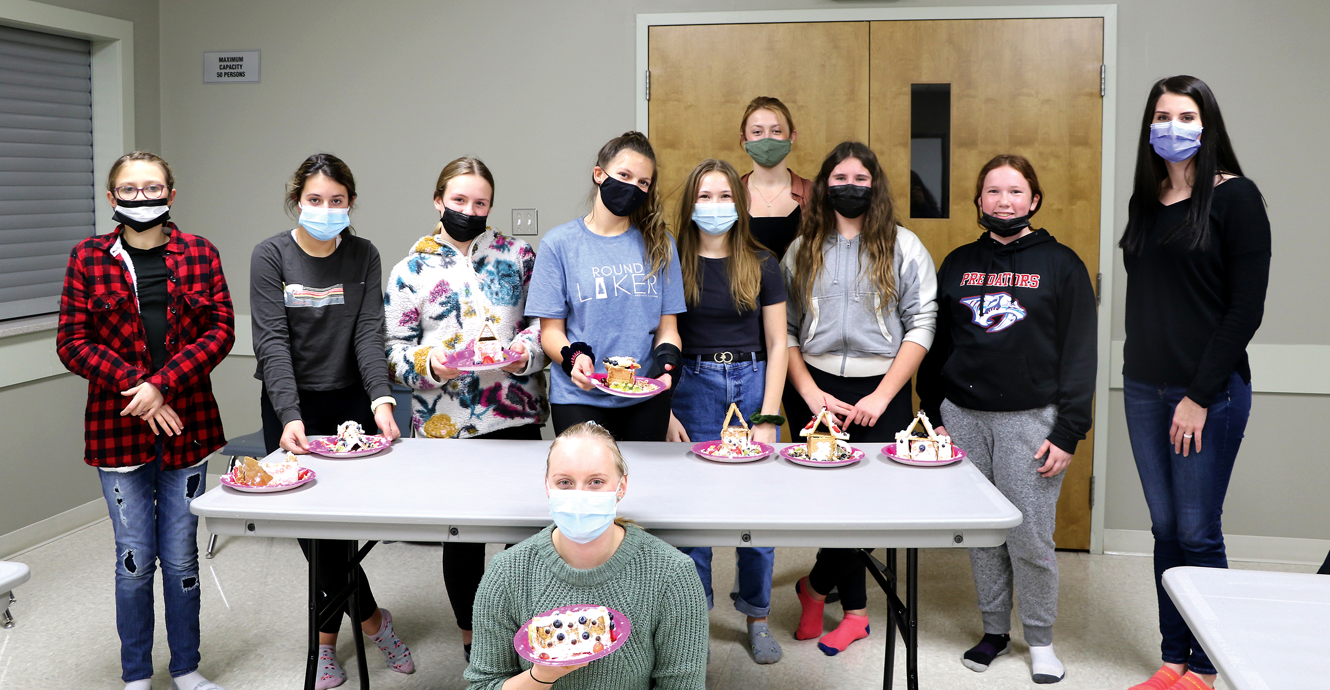 At this months HER Girl Clubs event hosted by Class with Cass Holistic Nutrition, the girls made healthy ginger bread houses. Left: Maya McMullen, Tess Nagy, Myla Woods, Kendall Shipp, Macy Rushton, Paige Hutchinson, Miley Bell and Jaz Koroscil, Kassidy Robidoux and Lauren van Dyke (bottom).