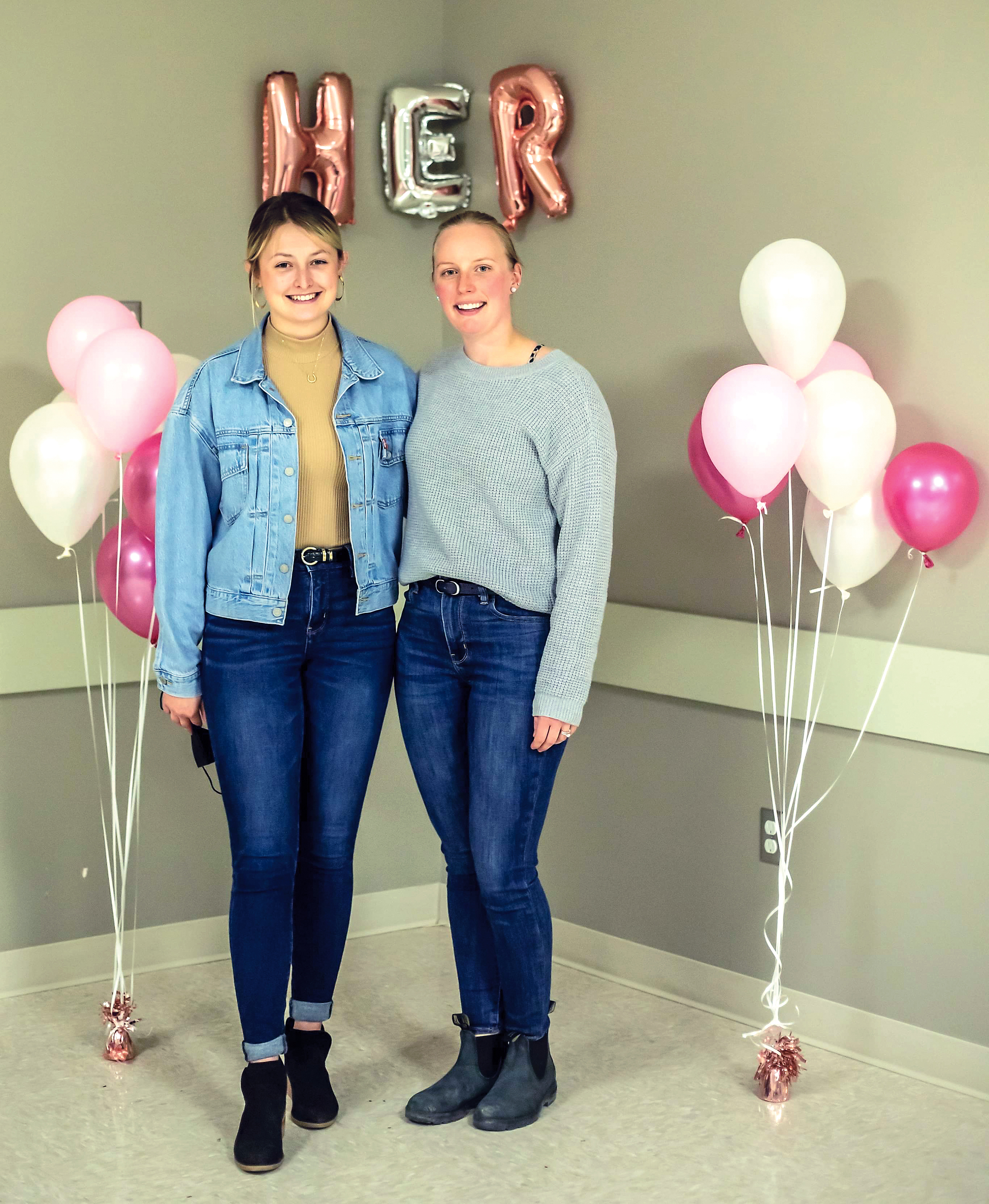 Paige Hutchinson, the president of HER Girl Club and Lauren van Dyke, the vice-president at the celebration of the groups one year.