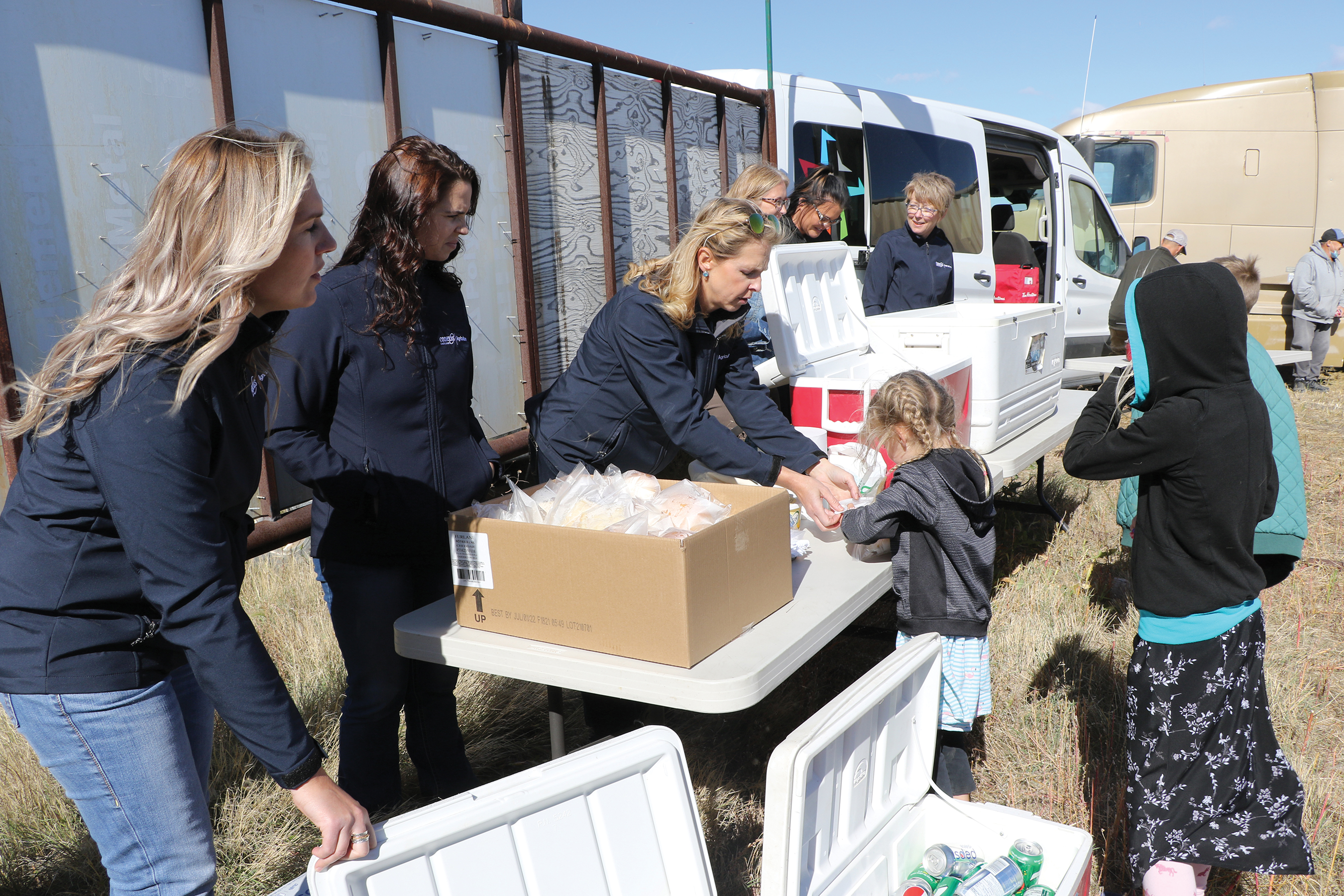 Conexus Credit Union employees served lunch at the harvest day.