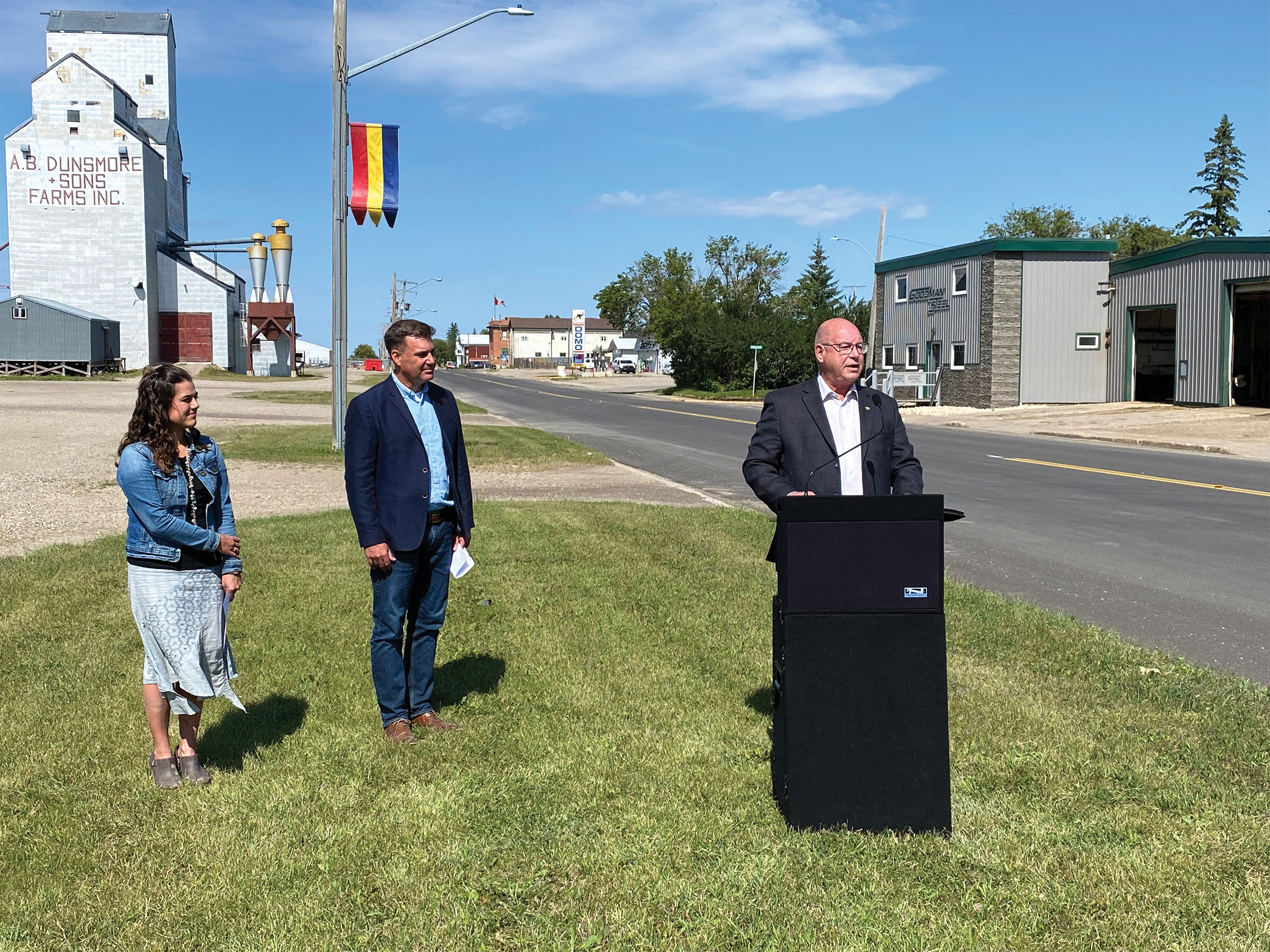 Saskatchewan Highways minister Fred Bradshaw giving his speech while Moosomin MLA Steven Bonk and RM of Rocanville Reeve Melissa Ruhland look on.