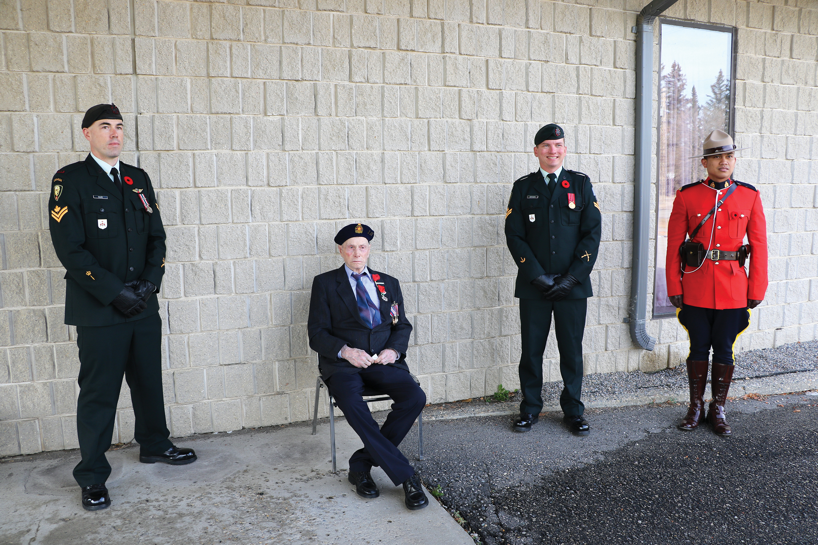 Lloyd Tibbats with members of his former unit, the Regina Rifles.