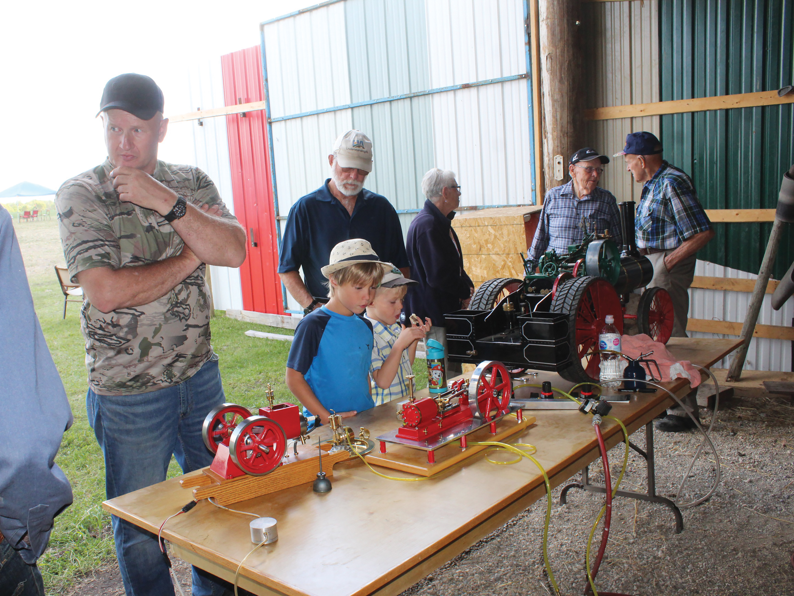 Children looking at some of the engines on display.