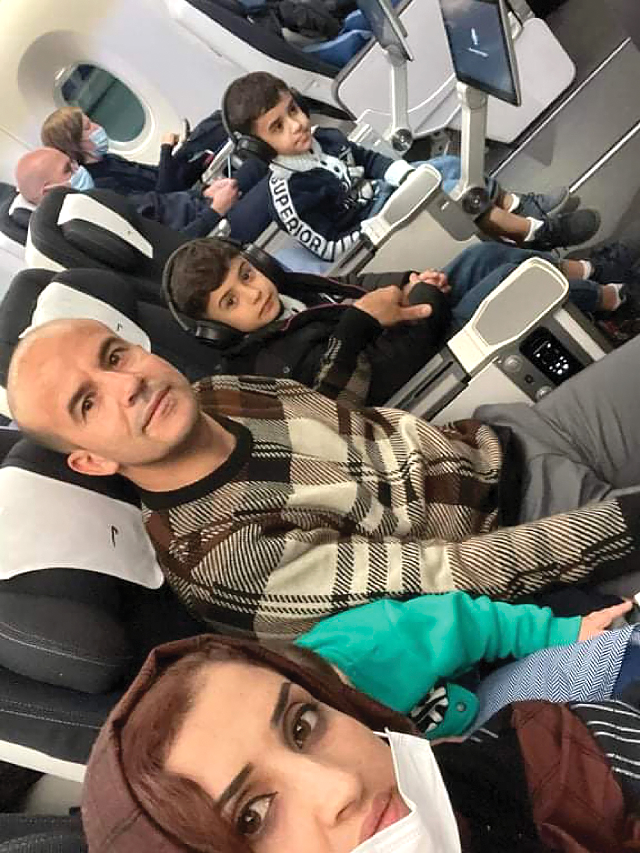 The Sediqi family en route from Islamabad to Vancouver.