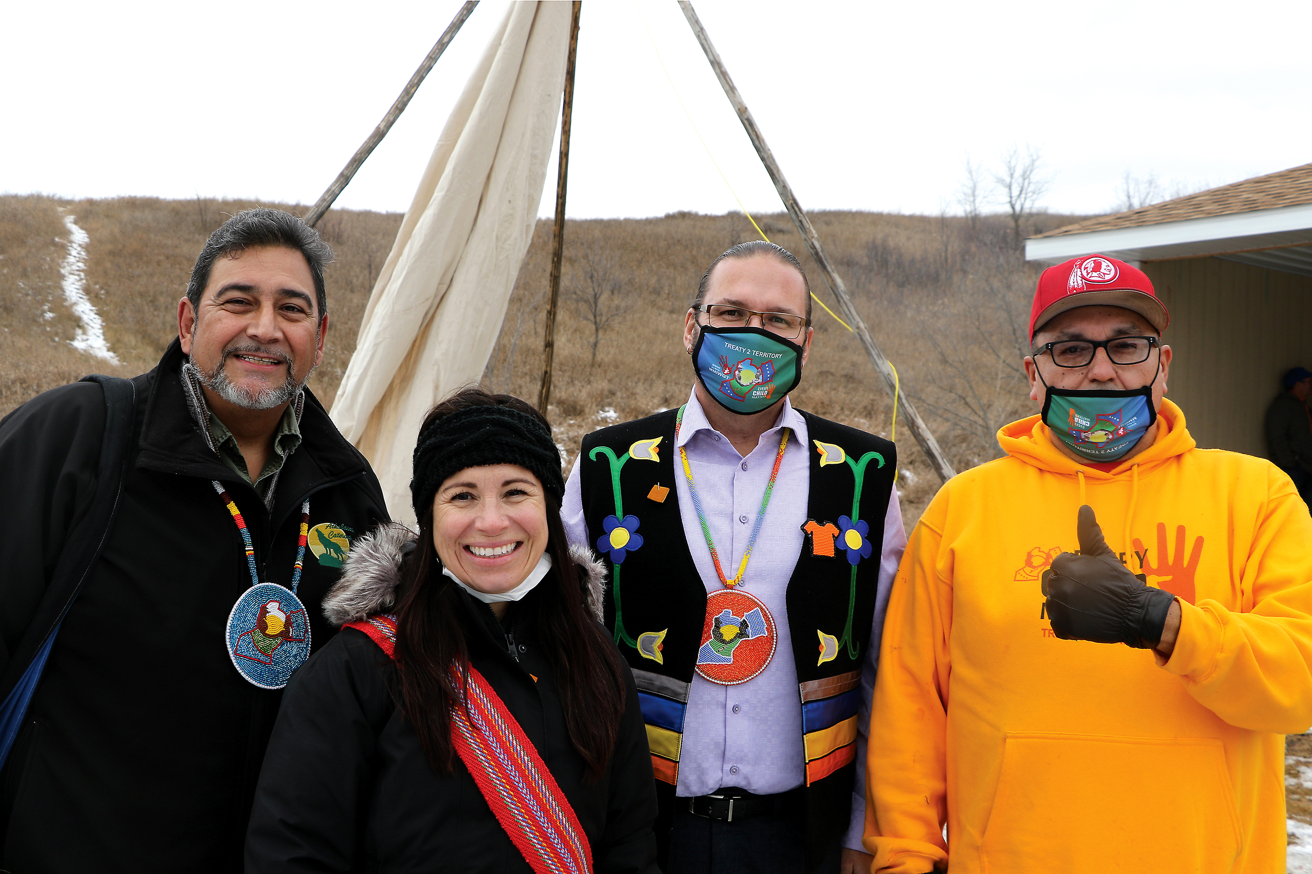 Allen Sutherland Skownan, First Nation Treaty 2, Tanya Huberdeau-Simard (pre-kindergarden teacher), Boh Kubrovich Lead Keeper of Treaty 2 territory and Scott Lynxleg Tootinaowaziibeeng Treaty Reserve Treaty 4 in the building of the tipi at cole Saint-Lazare in Manitoba.