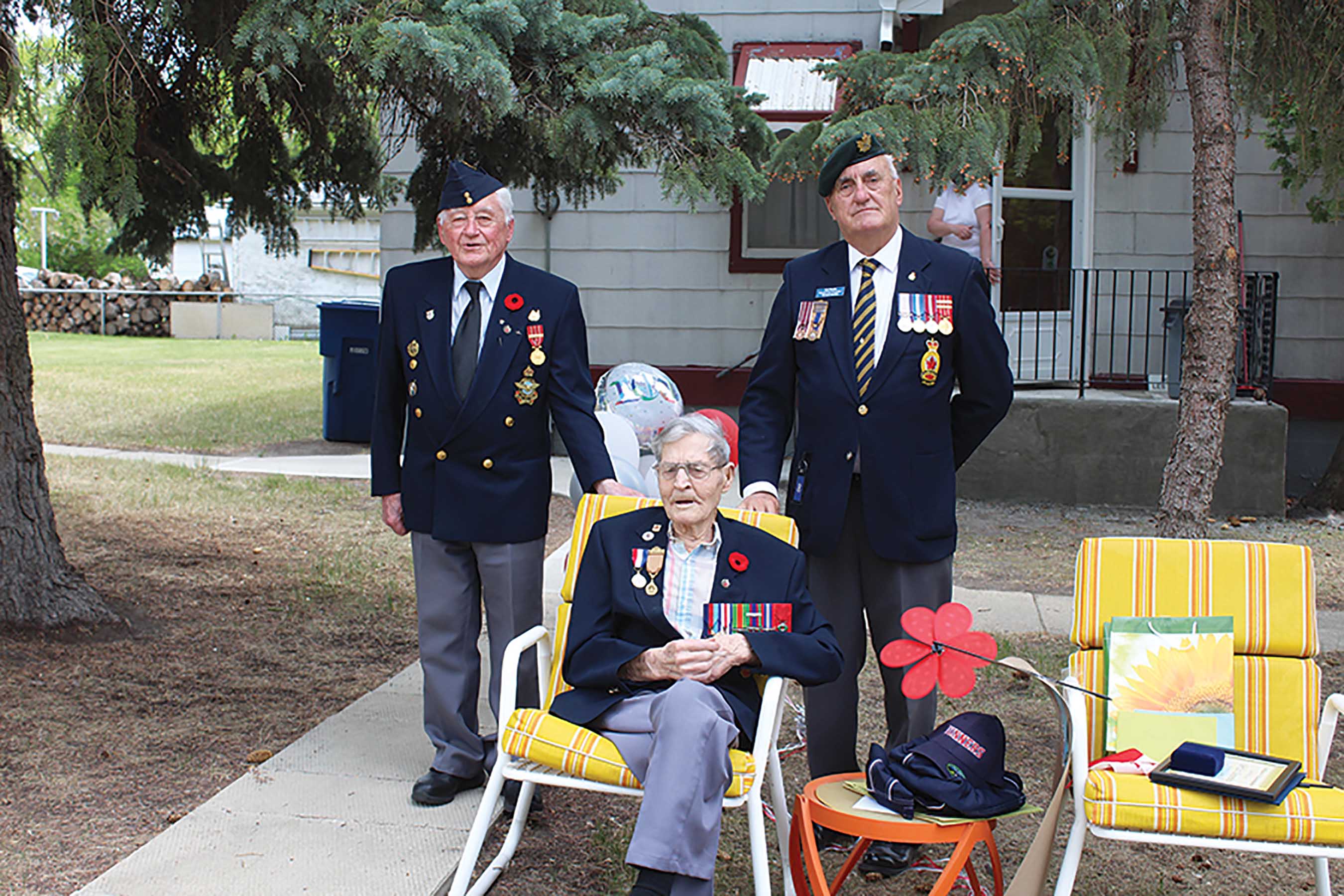 John Fefchak, left, a military veteran and caregiver to Les, center, and Captain Kelvon Smith, a long-time Virden educator. Smith was a major organizer of the birthday parade for Les, along with Fefchak.<br />