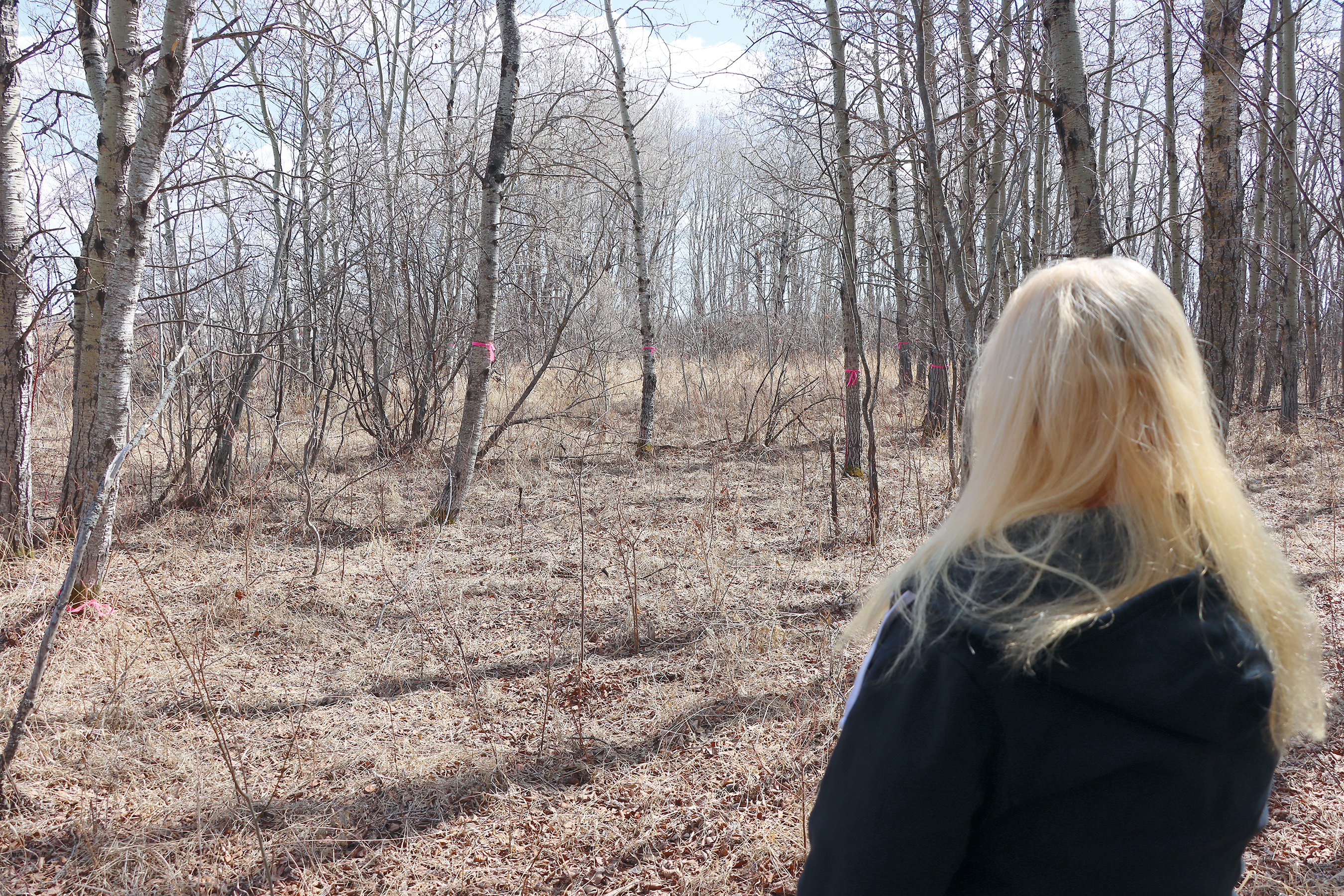 Assistant Rec Director Kelly Woywada shows where a picnic table will be set up along the outdoor walking trail that is expected to be completed by the end of June.