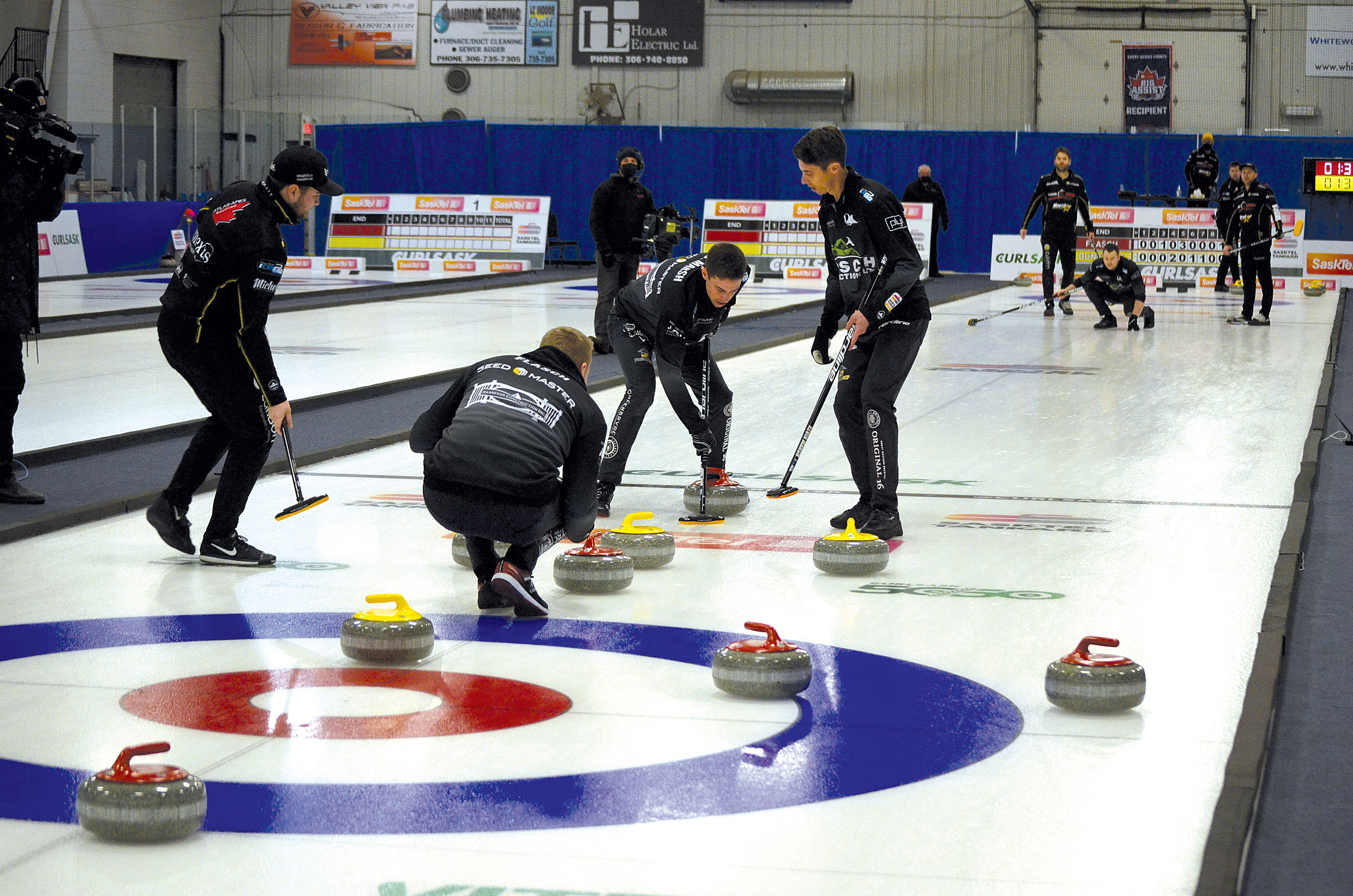 Skip Colton Flasch watches carefully after his third, Catlin Schneider, throws his rock in what was a close final game during the SaskTel Tankard in Whitewood Feb. 13. Sweeping Schneider�s rock were Flasch�s lead and second, Kevin Marsh and Daniel Marsh.