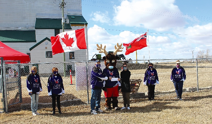 A payment by the Elkhorn Elks Club to Elkhorn School for the schools help in a recent club project helping the Elks sell their 2021 Cash Calendars. The Elks collected a $5 commission on each calendar and were able to pay $260 to the school. In centre are Ken Shackle, left, Charlie the Elks mascot, middle and school staff member, Stephanie Malcolm, right, accepting the cheque.