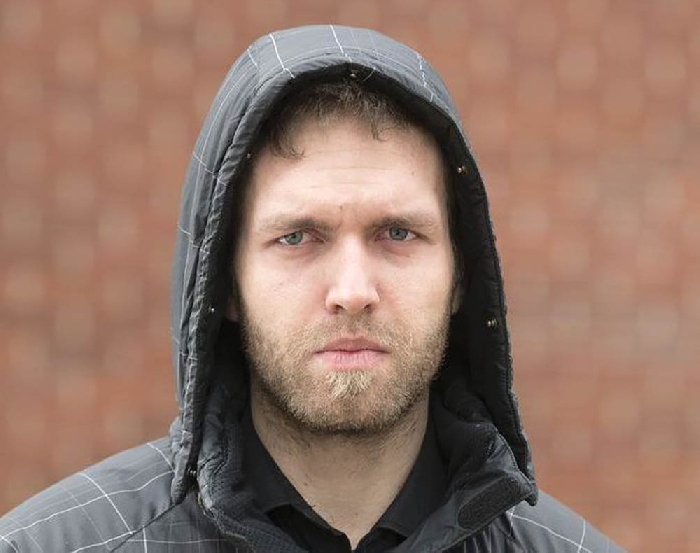 Travis Patron following a court appearance on charges of Aggravated Assault and Assault Causing Bodily Harm. Patron now faces a new charge of promoting hatred as the result of an anti-semitic video he posted.
