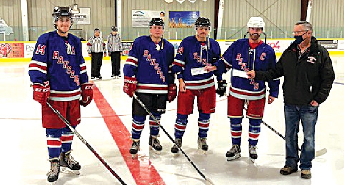 Left to Right: Brayden Nabholz of the Moosomin Rangers, Devin Jamieson, Tyson Jamieson, Paul Stapleton and Trevor Goodman of the  Rocanville Tigers. Both organizations teamed up this past weekend and donated the money collected through the 50/50 from both games to the Jamieson family. The Moosomin Rangers raised $1040 and Rocanville Tigers raised $745.