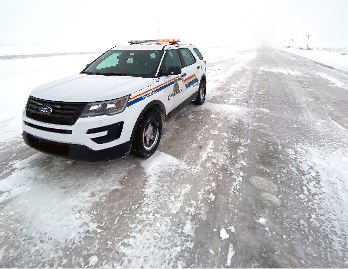 The icy road conditions three miles east of Wolseley along Highway 1, which is completely blocked by a jacknifed semi and has a lengthy backup of vehicles due to poor road conditions