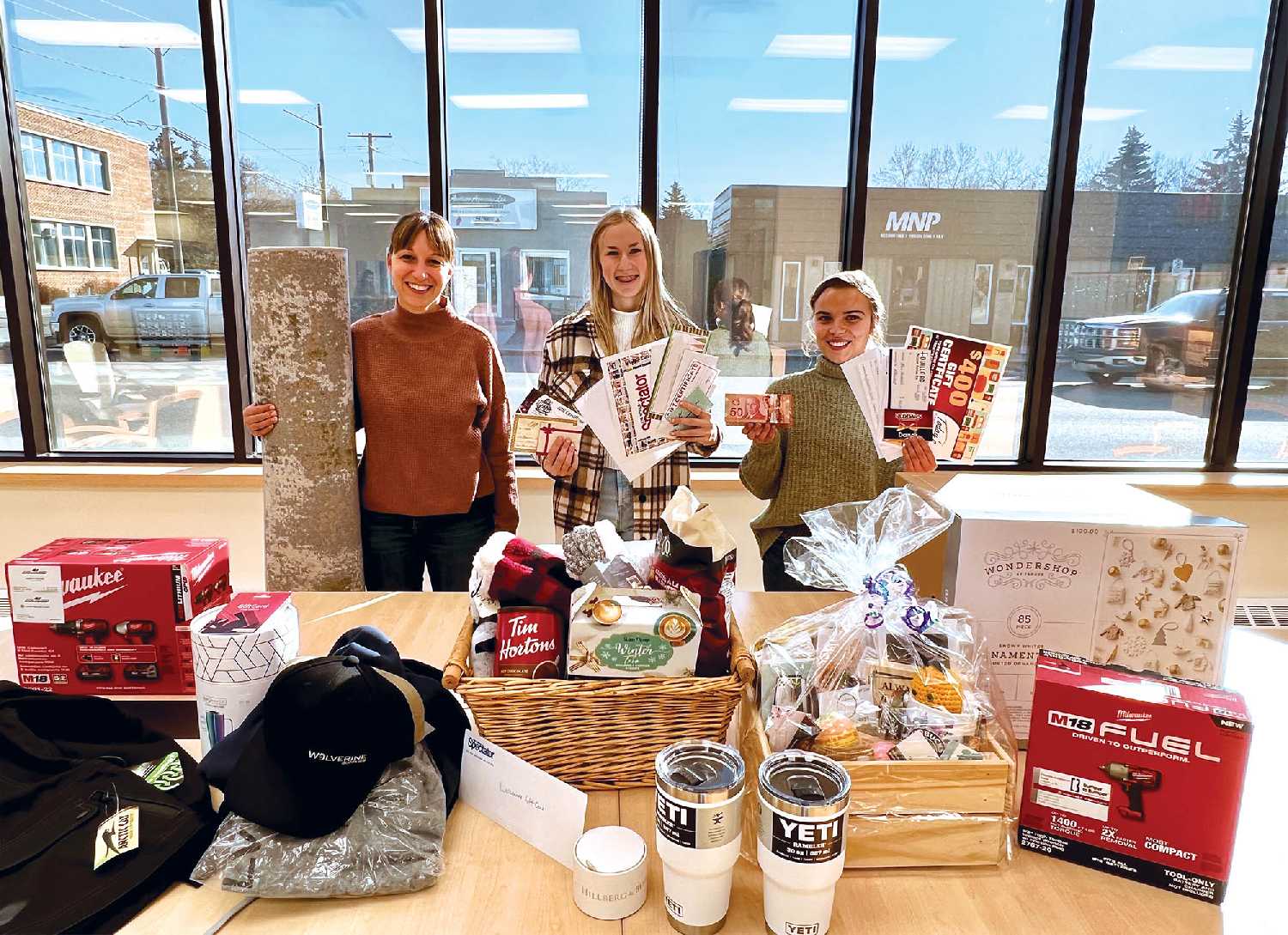 <b>Lots of prizes to give away</b> World-Spectator advertising staff Kara Kinna, Ashley Bochek and Sunnette Kamffer with some of the 55 secondary prizes that are being given away in the World-Spectators $15,000 Christmas Giveaway.