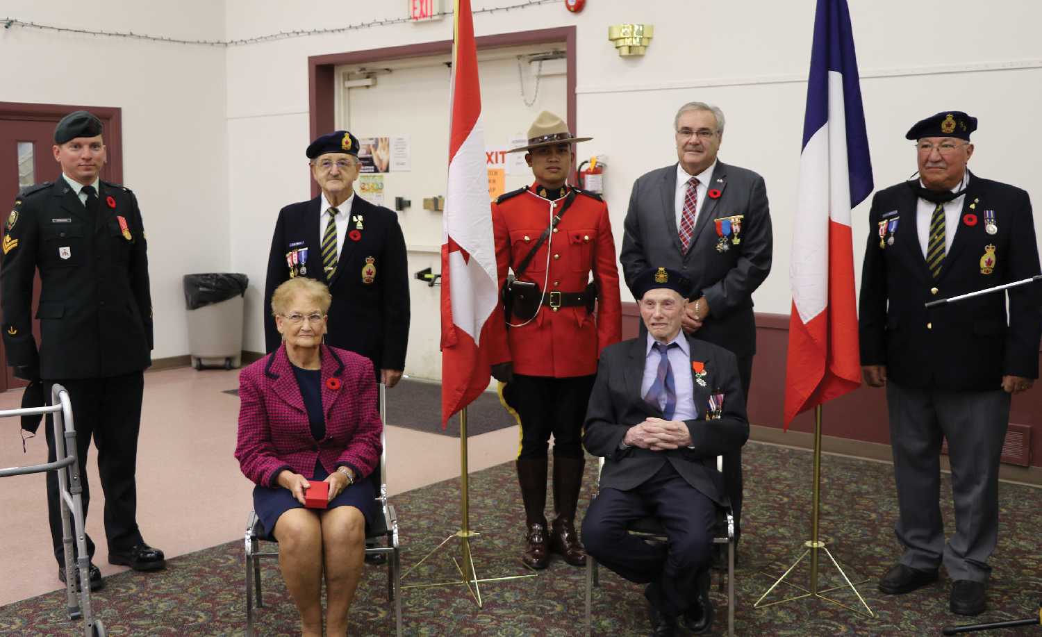 Lloyd Tibbats with representatives of the Regina Rifles, the RCMP, the Russell Legion, and French Consul Bruno Burnichon.