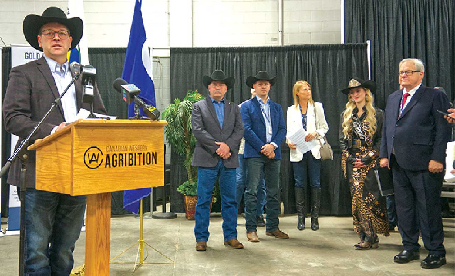Agribition President Michael Latimer welcomes guests to the 53rd edition of Agribition in Regina last week as dignitaries look on. From left are Provincial Agriculture Minister Daryl Harrison, Canadian Western Agribition CEO Shaun Kindopp, Deputy City of Regina Manager Jennifer Johnson, Miss Rodeo Agribiton 2023/24 Ari Dyck, and federal Agriculture Minister Lawrence MacAuley.