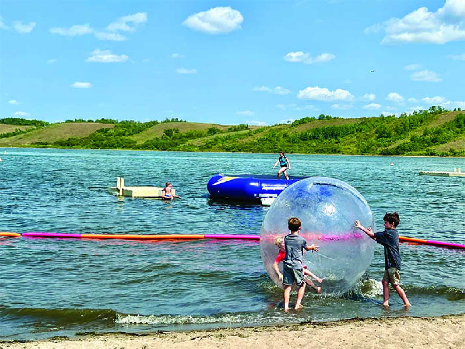 Kids enjoying the beach and the lake.
