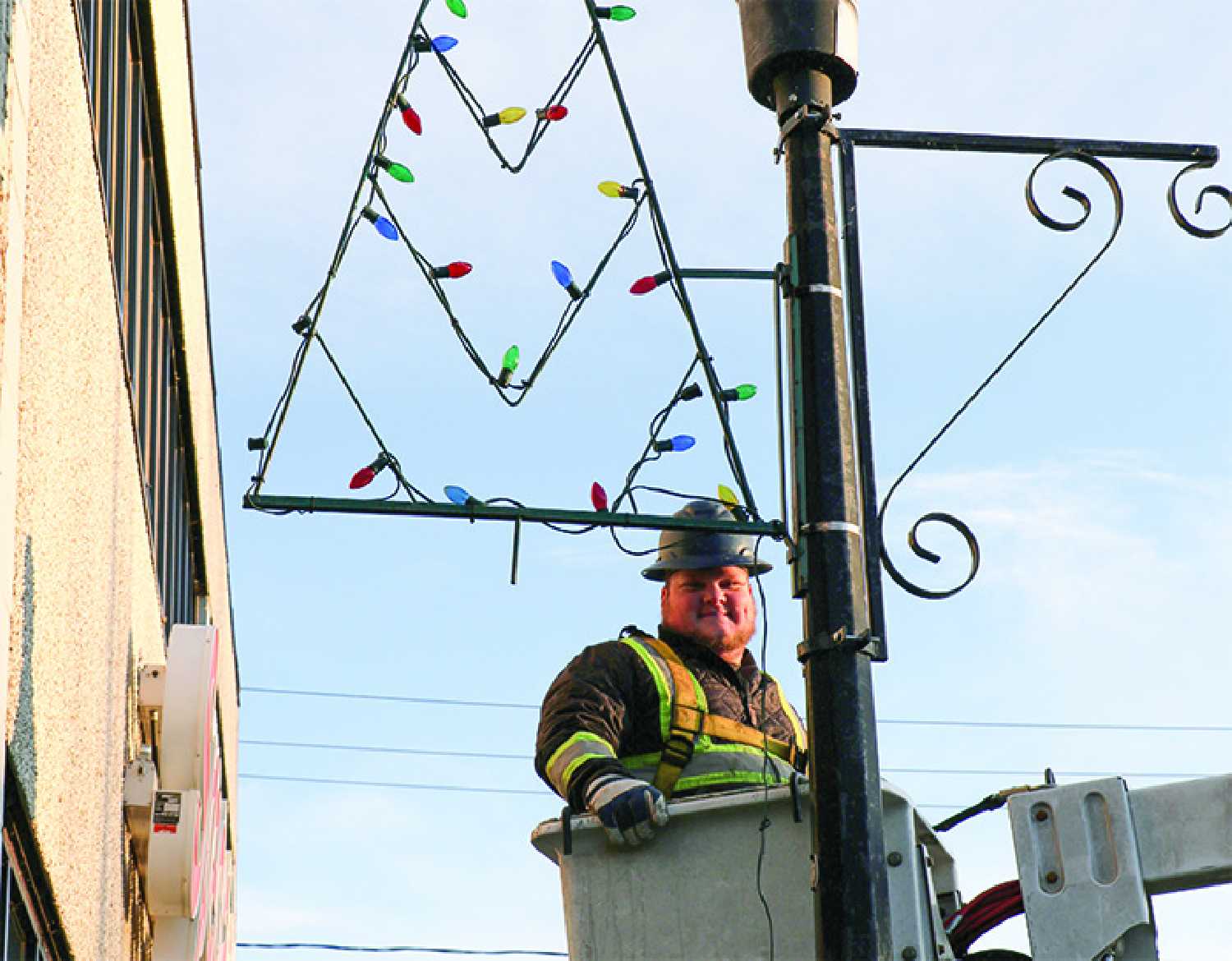Daniel Miskiman with the Moosomin town crew was helping to hang up Christmas decorations in Moosomin last week for the Christmas season