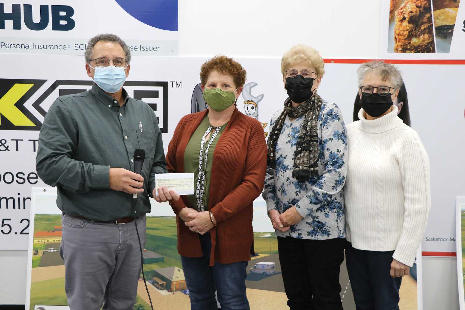 Jeff St. Onge accepting a $10,000 donation for the Moosomin airport project from Moosomin Thrift Store board members Lori Shepherd, Marilyn Klinger and Beryl Stewart.