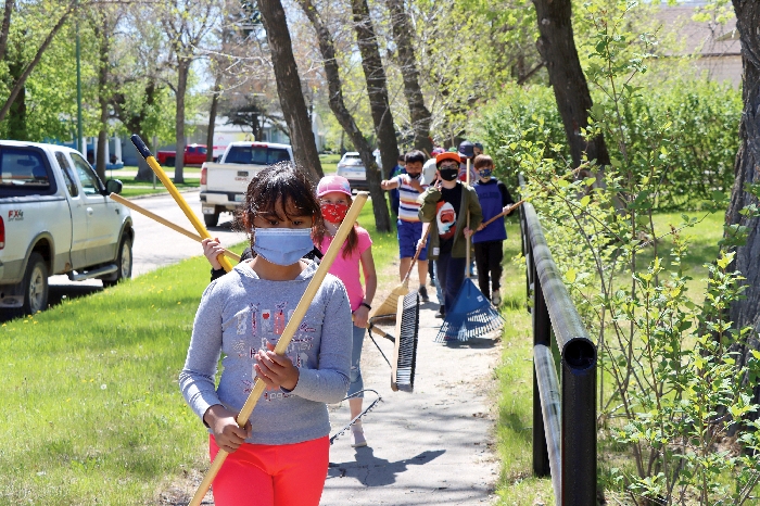 Grade 4 students from MacLeod Elementary took to the Moosomin Cenotaph Park last Thursday tidy it up.