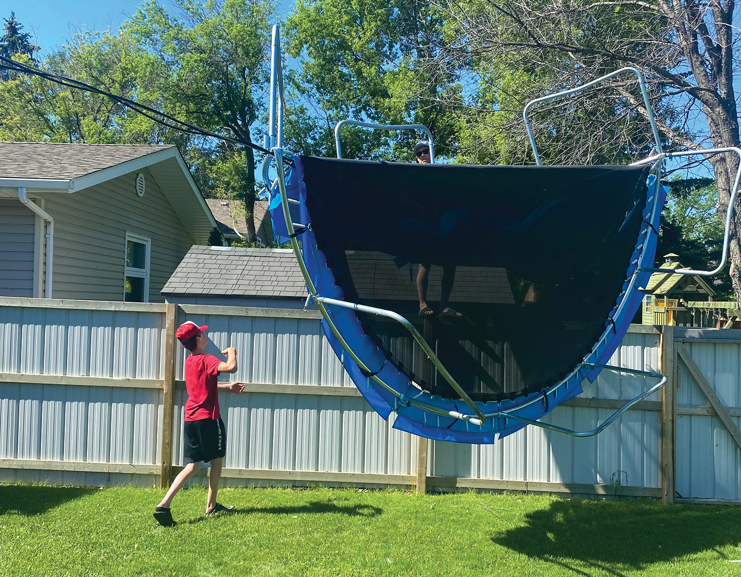 A trampoline is folded over a power line in Moosomin.
