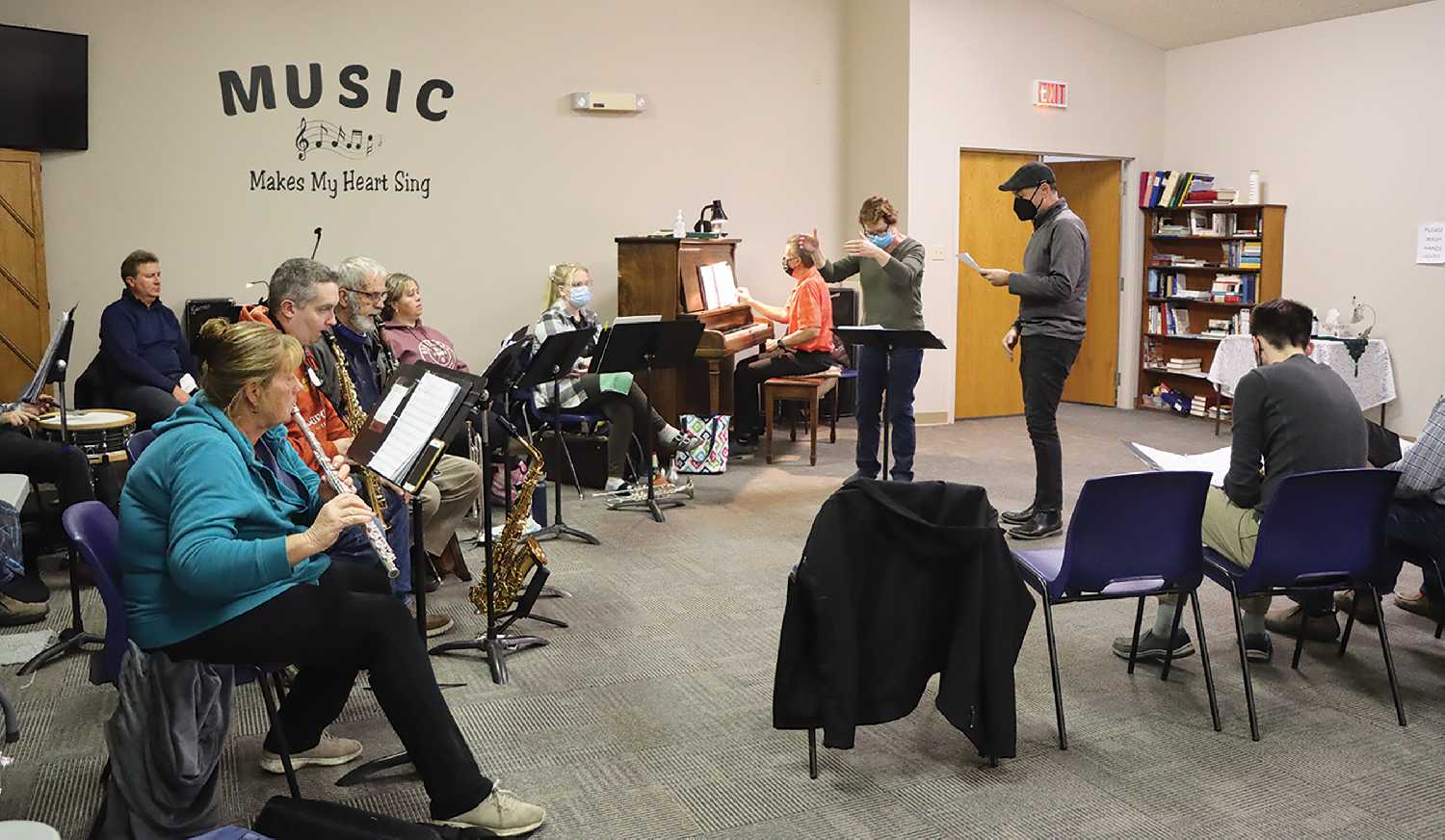 The band and some of the singers rehearsing for “All Together Now” with Sandra Poole conducting and Barry Rambold accompanying on piano, while Jarrod Slugoski performs a piece from Beauty and the Beast.