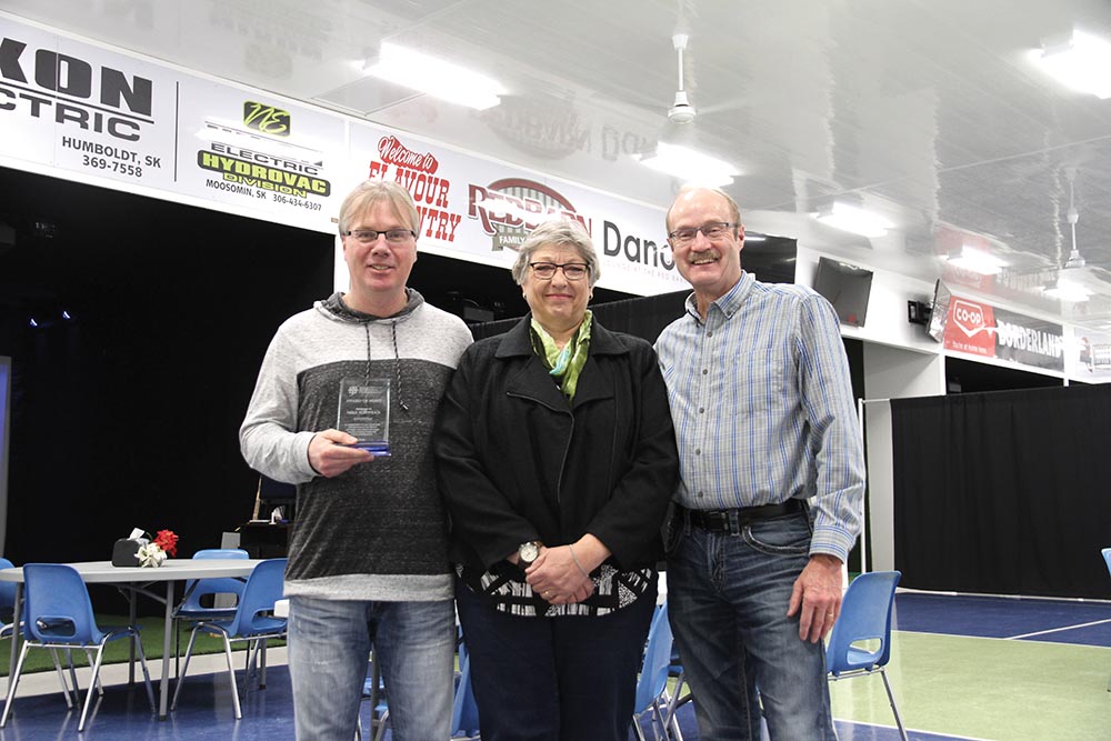 Mike Schwean receiving a previous awardthe Saskatchewan Association of Recreation Professionals Award of Merit in 2017, with Shelley Thoen-Chaykoski of the association, and former Councillor Terry Lynd, who nominated him.